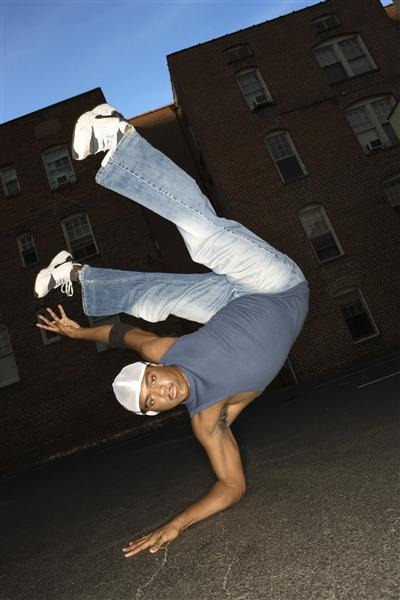 Break-dancer balancing on one hand
