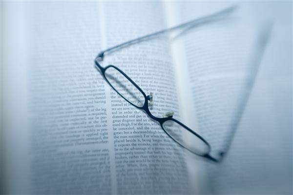 Eyeglasses and Book