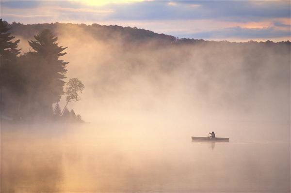 Canoe on a Foggy Lake