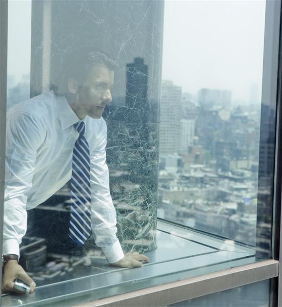 Businessman Looking out Window